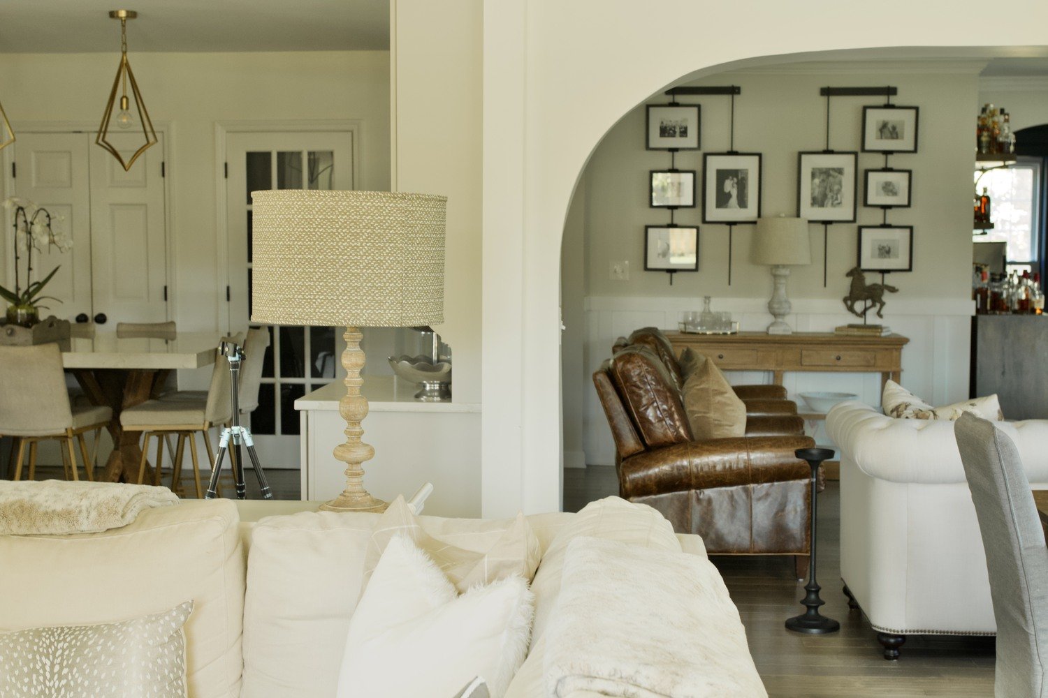 Transitional living space connecting kitchen and sitting room in a Louisville custom home by Trade Works Remodeling