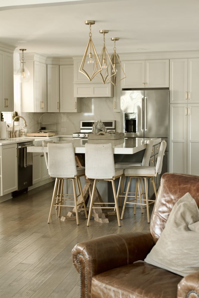 White kitchen remodel with gold pendant lights by Trade Works Remodeling in Louisville, KY