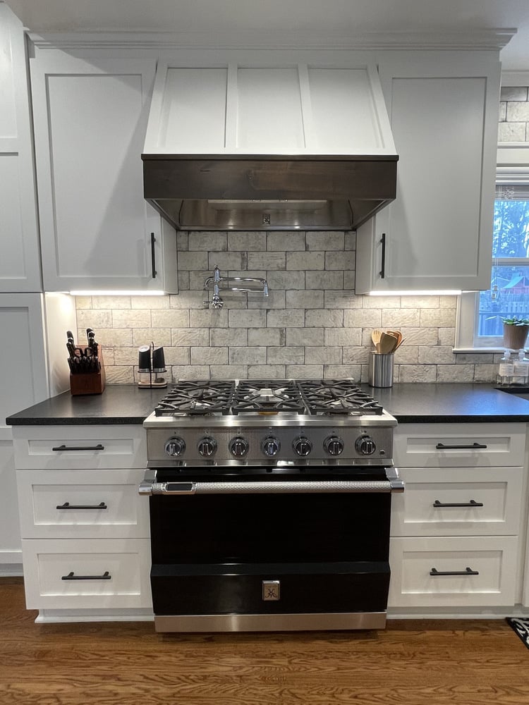 Modern kitchen renovation featuring stainless steel range in Douglass, KY by Trade Works Remodeling